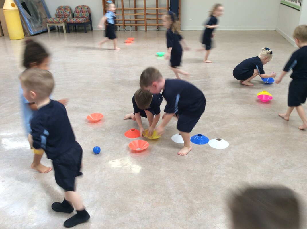 Image of Reception class practising their target skills.